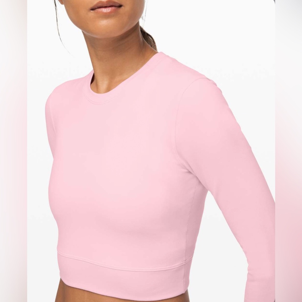 Womens 3/4 sleeve top from Lululemon. Mesh detail on back,size 10 but fits small